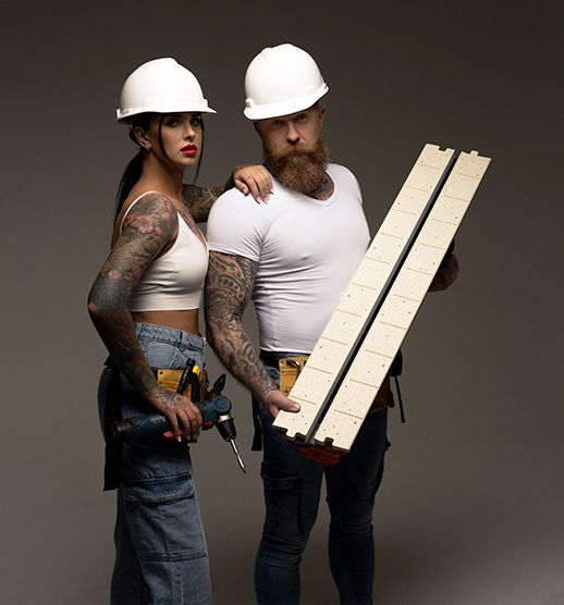 Professional installers holding a LINEO PRO linear slot diffuser to show the frameless gypsum construction and modular puzzle connection.