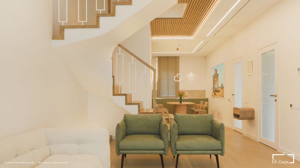 Living area and curved staircase with timber ceiling slats and ERGOVENT linear slot diffusers